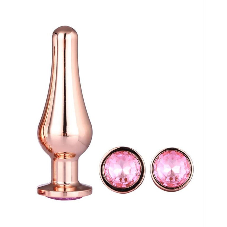 A sleek rose gold vibrator with a smooth, curved design, accompanied by matching pink gem earrings, ideal for enhancing intimacy and pleasure. Perfect for modern adult wellness and sexual health.