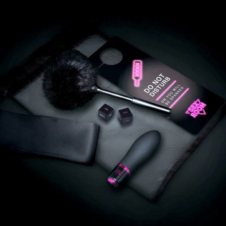 An image showcasing a modern, remote-controlled sex toy set with a sleek design, including a vibrator, remote, and accessories, emphasizing discreet pleasure products for adult intimacy.