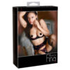 A woman in black lingerie posing in a box.