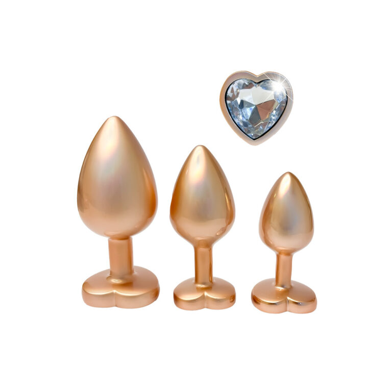 Gold anal plugs with a heart-shaped crystal, perfect for enhancing intimacy and pleasure, combining luxury design with high-quality materials for a premium sextech experience.