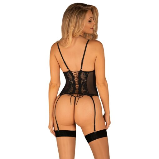 The back of a woman wearing a black lingerer and stockings.
