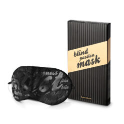 A black and gold eye mask next to a box.