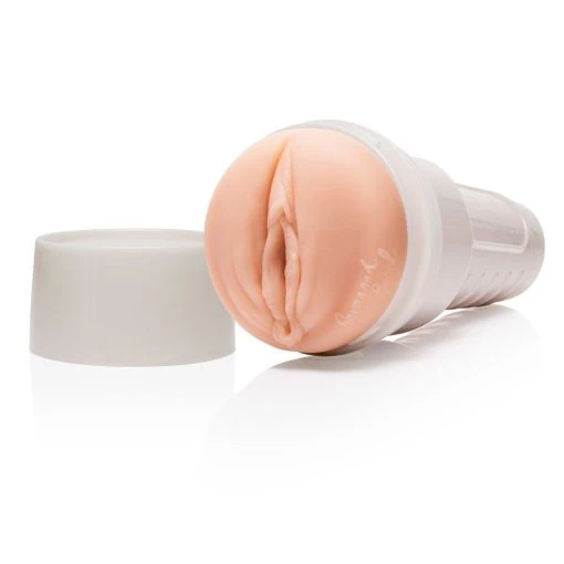 A pink sex toy on a white surface.