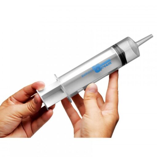 A person holding a plastic tube with a syringe in it.