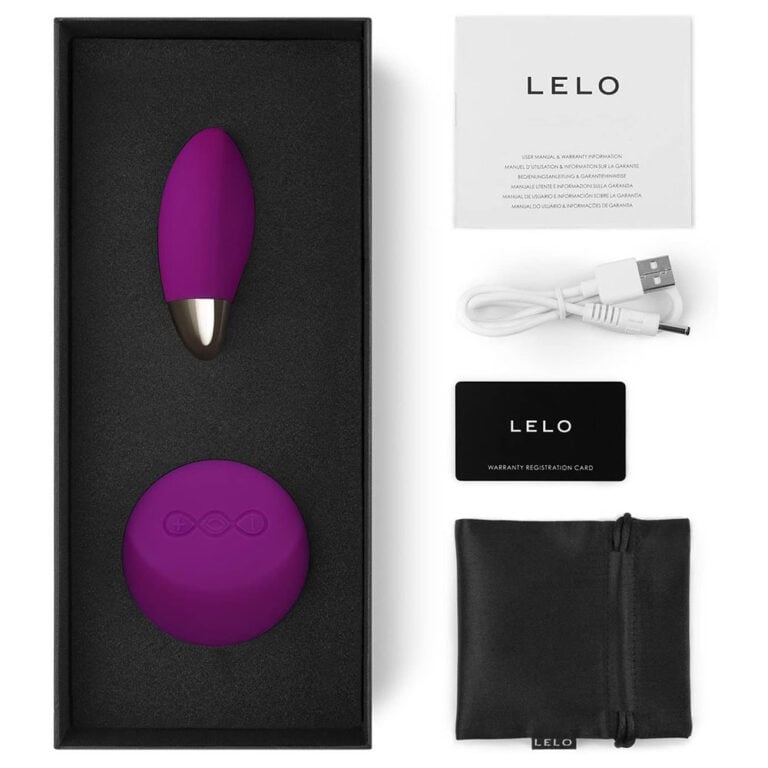 An elegant purple Lelo vibrator with a matching remote control, USB charging cable, warranty card, and storage pouch, designed for discreet pleasure and high-quality intimacy experiences.