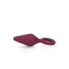 A burgundy shaped sex toy on a white surface.