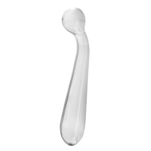 A clear glass spoon on a white background.