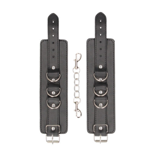 A pair of black leather cuffs with metal buckles.