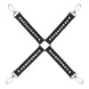 A pair of black cross straps with metal hooks.