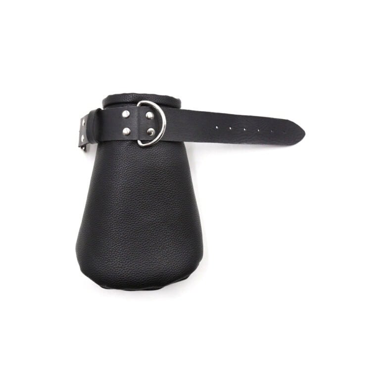 Leather BDSM paddle with adjustable strap for adult intimacy and role-play. High-quality, discreet design suitable for consensual adult use and enhancing sexual experiences.