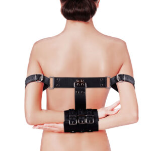 The back view of a woman wearing a black back brace.