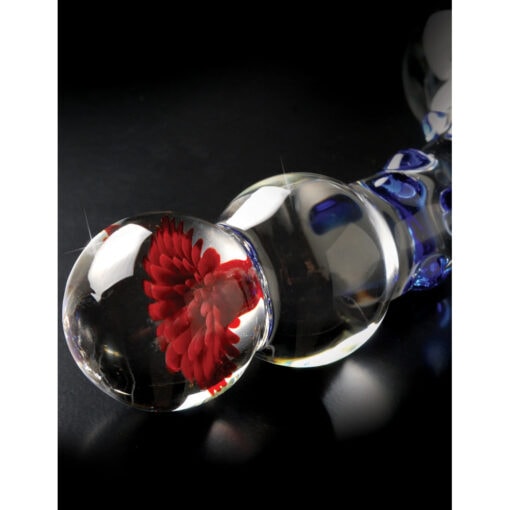 A glass pipe with a red flower on it.