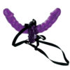 A purple sex toy with a black strap.