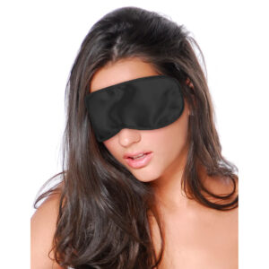 A woman wearing a black eye mask.