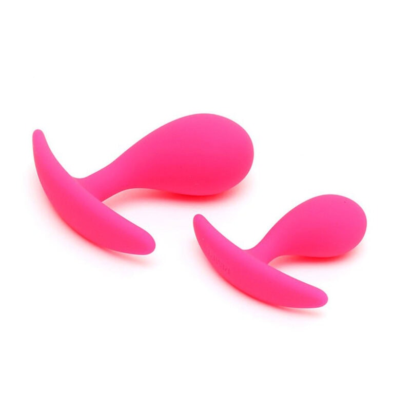 Two pink silicone vibrators designed for intimate pleasure and stimulation. Ergonomic shape for comfortable use, ideal for enhancing personal intimacy and exploring sensual experiences.
