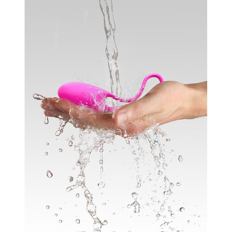 A pink waterproof vibrator being rinsed under water, highlighting its waterproof feature and suitability for intimate use.