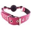 A pink leather collar with a ball on it.