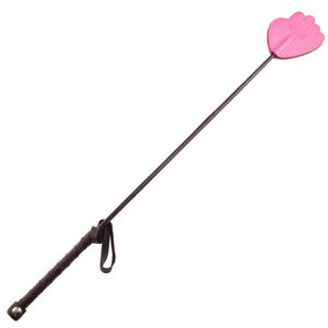 A pink stick with a pink handle on it.