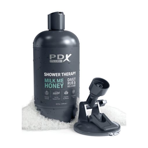 A bottle of pdx shower therapy with a bottle of honey.