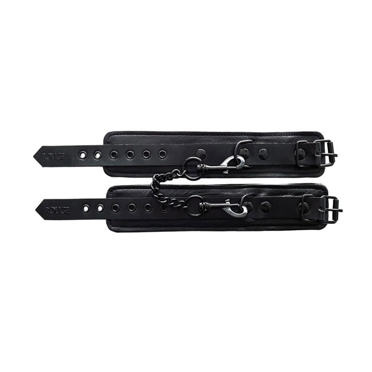 Leather bondage cuffs with adjustable straps and metal hardware for BDSM play and adult role-playing scenarios. Perfect for enhancing intimacy and exploring consensual power dynamics.
