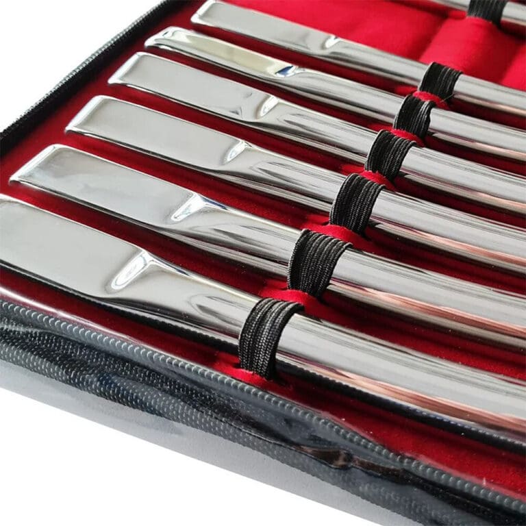 High-quality stainless steel knives with black handles, stored in a red-lined case for professional or home use. Perfect for culinary enthusiasts seeking durable, sharp kitchen tools.