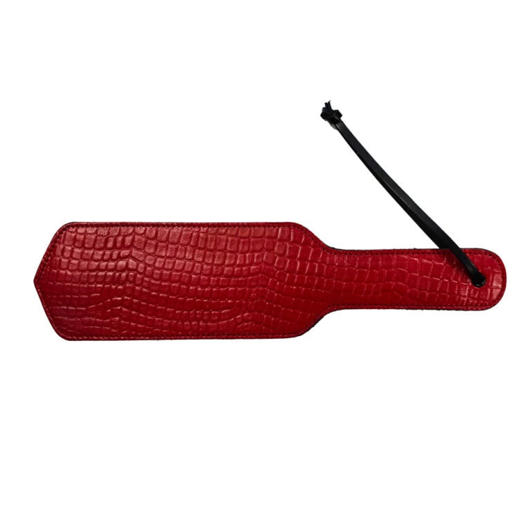 Red leather tag with crocodile texture, designed for luxury sextech products and accessories, adding a touch of elegance and sophistication to intimate items.