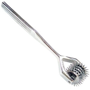 A stainless steel spatula with spikes on it.