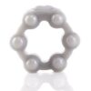 A grey plastic ring with white pearls on it.