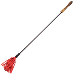 A red broom with a wooden handle.