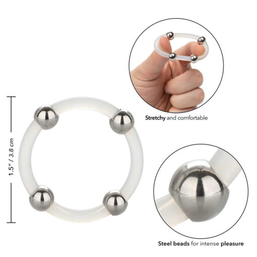 A hand is holding a ring with two balls on it.