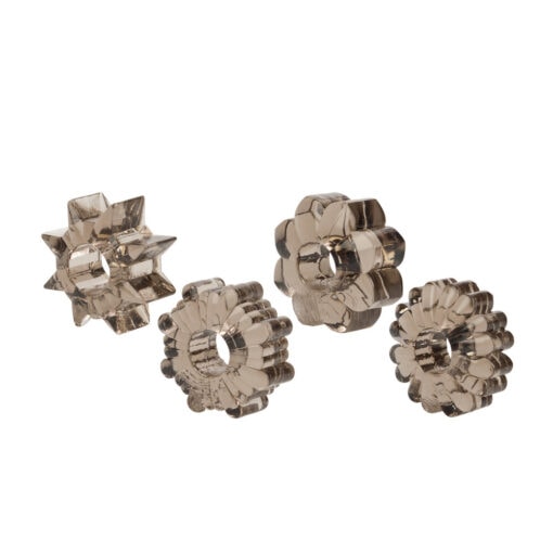 Four metal flower shaped parts on a white background.