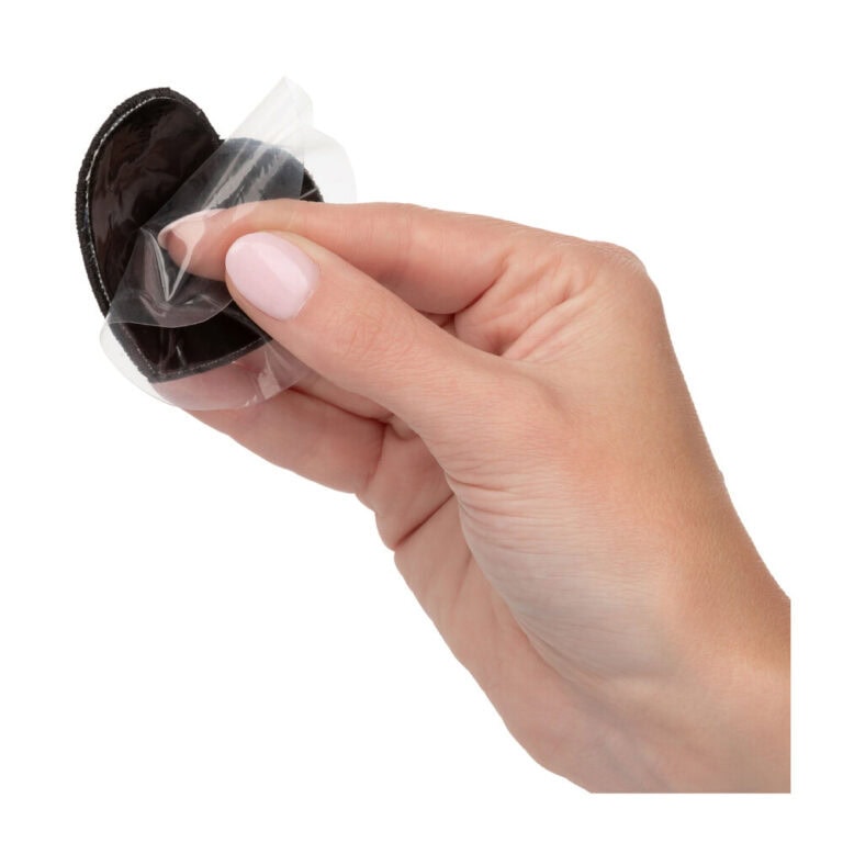 Condom in hand, ready for safe sex, emphasizing protection and sexual health. Ideal for promoting safe intimacy and preventing sexually transmitted infections.