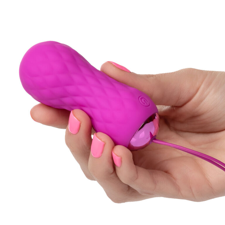 Pleasure vibrator in vibrant pink with textured surface, designed for intimate stimulation, perfect for enhancing personal pleasure and exploring sensual experiences.