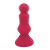 A red sex toy on a white background.