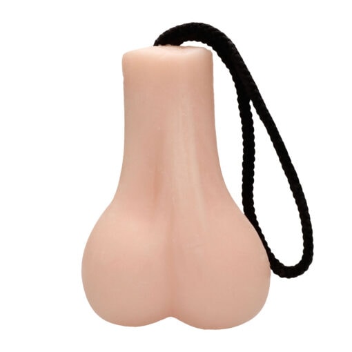 A plastic nipple toy with a rope attached to it.