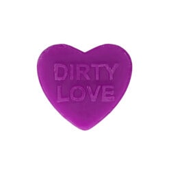 A purple heart shaped soap with the word dirty love on it.