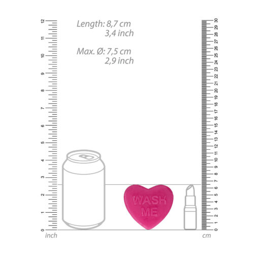 A ruler with a can and a bottle next to it.