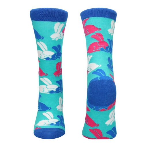 A pair of blue and pink socks with rabbits on them.