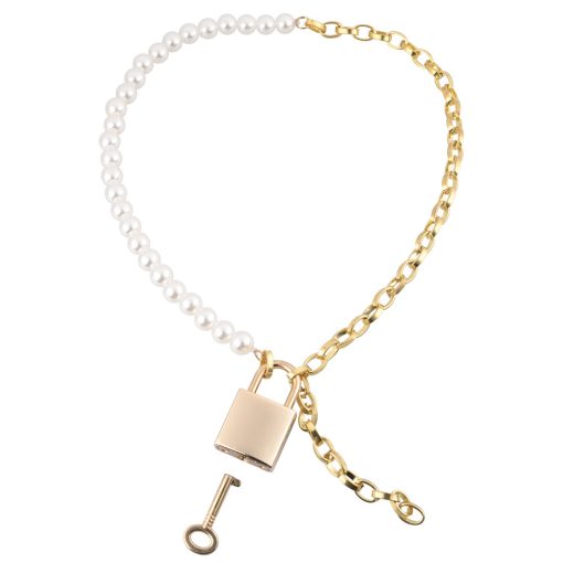 A gold and pearl necklace with a key and pearls.