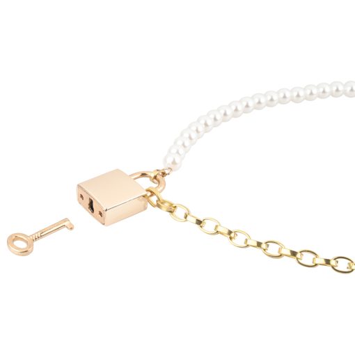 A necklace with a key and pearls.