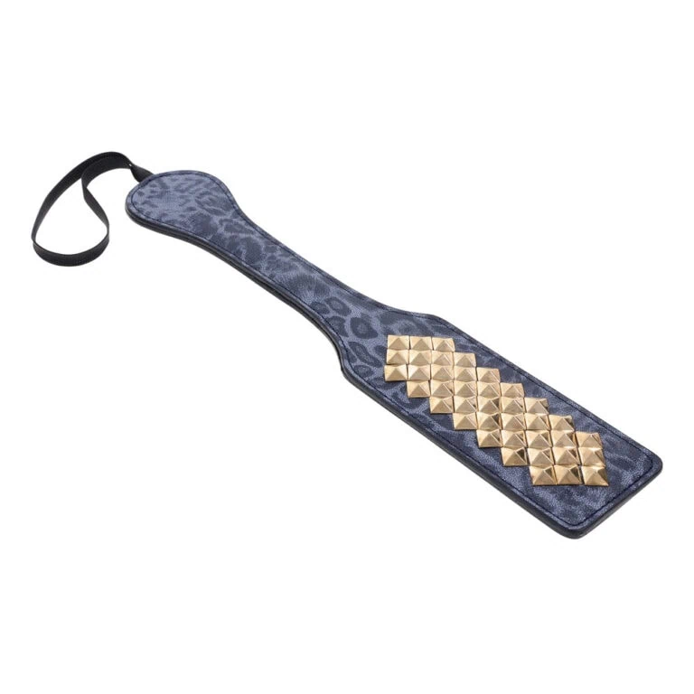 A high-quality BDSM paddle featuring a sleek, leopard-print design with gold-tone spikes for enhanced sensation and stimulation during adult intimate activities.