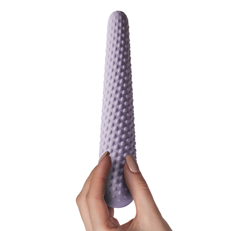 Close-up of a textured purple silicone wand, designed for adult pleasure, held by a hand, highlighting its ergonomic shape and tactile surface for enhanced sensation.