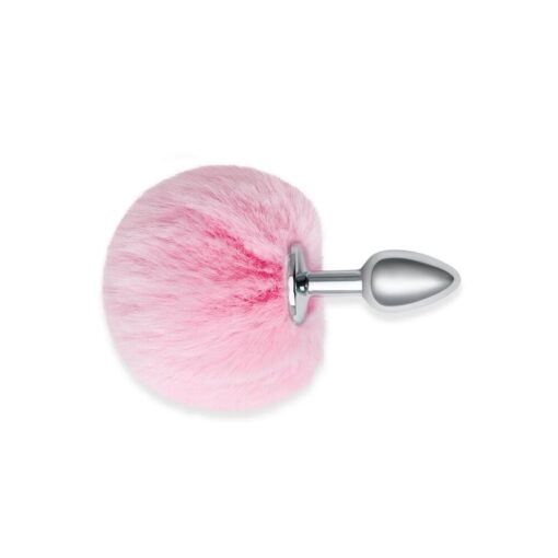 A pink furry ball with a spike on it.