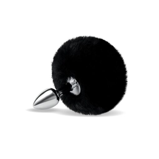 A black furry ball with a metal spike on it.