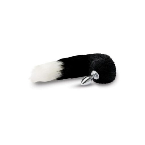 A black and white skunk tail on a white surface.