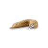 A fox tail with a silver spike on it.