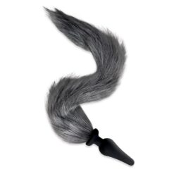 A black and gray fox tail on a white background.