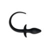 A black plastic hook on a white background.