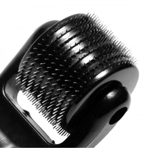 A close up of a black hair brush on a white background.