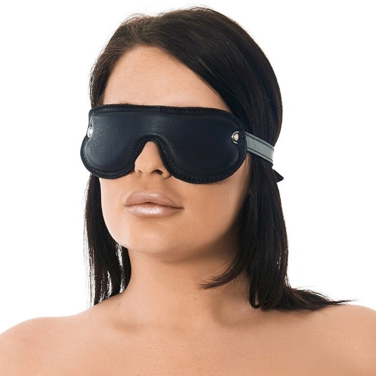 A woman wearing a black sensory sleep mask designed for relaxation, sensory deprivation, and enhancing intimate experiences. Perfect for couples and personal wellness routines.